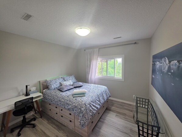 bedroom 2 with Queen bed and desk
