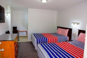 Comfortable room with two Double size bed and a TV Exact unit will be assigned upon arrival. Views, colors and decoration may vary.