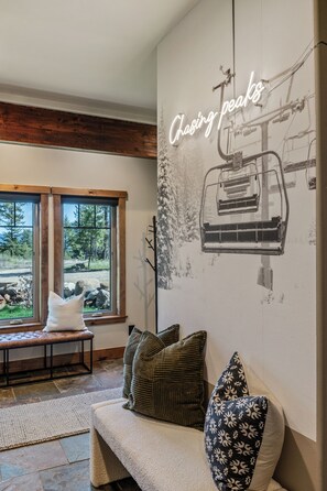 Side entryway with double benches. Who's ready to chase some peaks? 