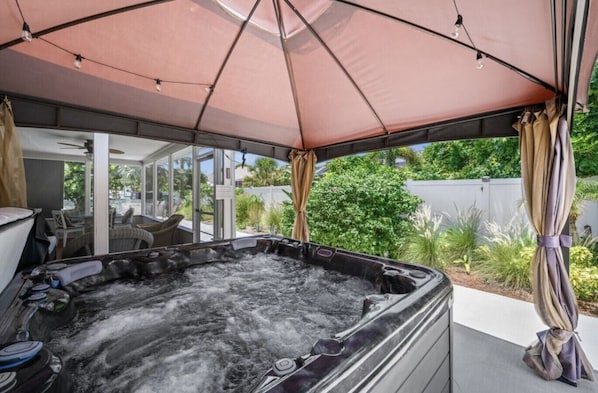 4 person jacuzzi under pergola