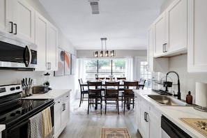 Fully equipped kitchen with high quality granite countertops.