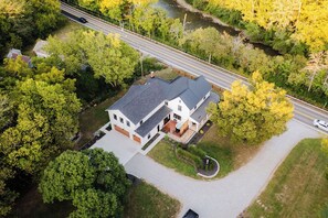 Modern riverside home with parking, perfect for a peaceful gateway.