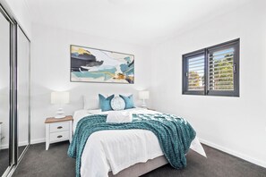 Retreat to a peaceful and well-appointed bedroom, designed for comfort and tranquility.