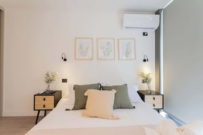Experience tranquility in this beautifully designed bedroom, featuring elegant decor and natural light for a restful retreat.