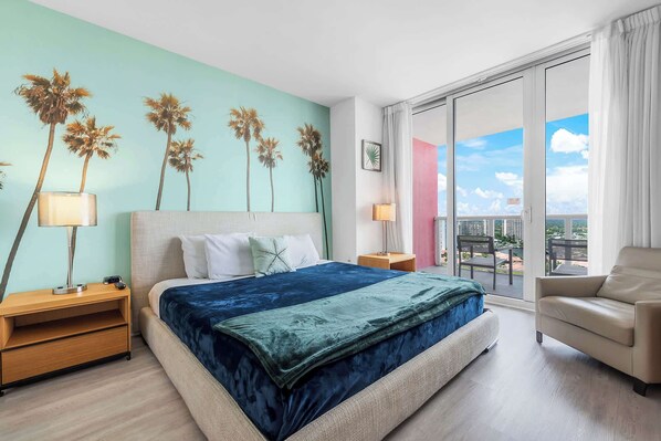 Experience luxury in our master bedroom with a king-sized bed and a connecting balcony offering stunning waterfront views.