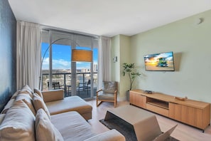 From the living room, step onto the connecting balcony to enjoy waterfront panoramas and beautiful sunsets.