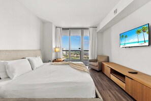Experience luxury in our master bedroom with a king-sized bed and a connecting balcony offering stunning waterfront views.