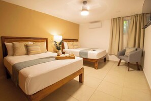 the second bedroom has 2 double beds and a Smart TV