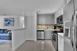 Bright and functional kitchen space with an inviting seating area close by in Boca Raton