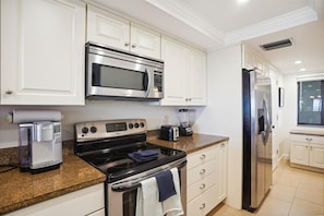 Full kitchen with oven, microwave, refrigerator, oven & k-cup coffee maker