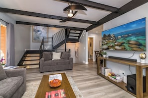 Living room has a TV with Roku 4K streaming & Bluetooth Soundbar