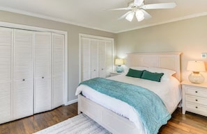 Queen room on main level.Huge wall of windows looking to the mountains and trees