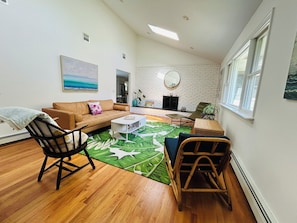 Tranquil living room with double-sided fireplace.