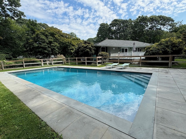 Heated, saltwater, gunite pool. Fulled fenced in with deep end benches.