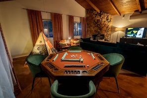Gameroom area with poker table, bumper pool, and board games. Many games provided.