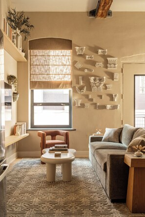 Custom sculptured accents, comfortable furniture, and warm tones.