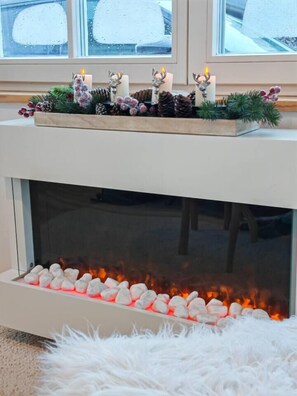 Electric fireplace for cozy hours with a unique view