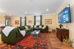 Super cozy, high end couch with 70" smart TV - in the main downstairs living