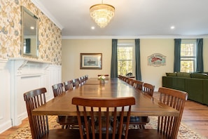 Our beautiful grand hard wood dining table - seats 20 people