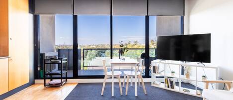 Floor-to-ceiling windows create a bright and spacious atmosphere