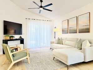 Stylish and modern living room adorned with elegant decor, featuring smart TV.