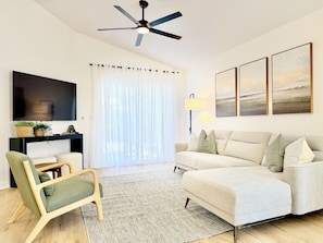 Stylish and modern living room adorned with elegant decor, featuring smart TV.