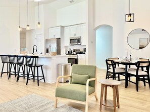 The living room is connected to the equipped kitchen and dining space