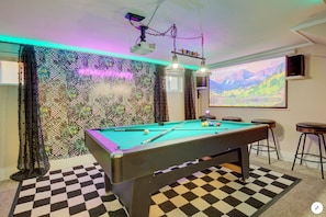 Pool table with HD projector, Polk speakers, and color changing lights.