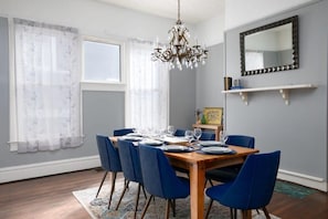 Simple Dining room with wooden table and chandelier