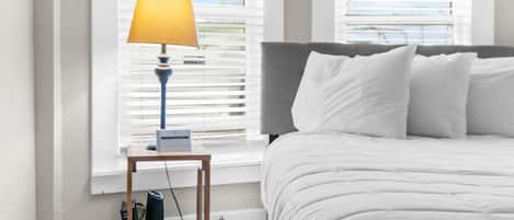 Comfy bedding with fluffy pillows.