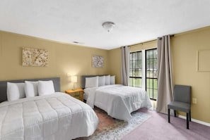 Comfortable double beds with large windows