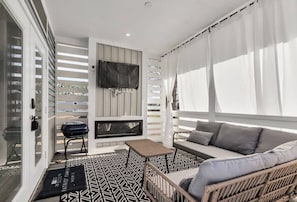 Cozy patio with outdoor furniture and SmartTV