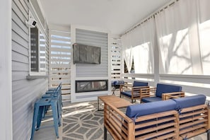 Cozy patio with outdoor furniture and SmartTV