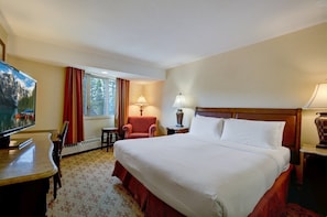 The Deluxe King Hotel Room features a luxurious king bed