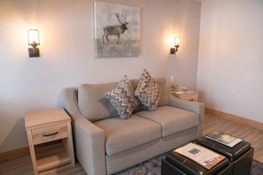 Retreat to this cozy, open-concept living space after a day playing in the mountains.