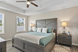 Spacious master bedroom featuring a private ensuite bathroom and a Smart TV—designed for comfort, convenience, and relaxation.