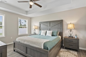 Spacious master bedroom featuring a private ensuite bathroom and a Smart TV—designed for comfort, convenience, and relaxation.