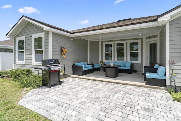Unwind in this welcoming outdoor space complete with a cozy gas fire pit and BBQ grill—perfect for enjoying evening meals and relaxed gatherings.