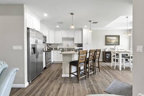 Bright and airy open-concept home with seamless flow between the living, dining, and kitchen areas—perfect for gathering and entertaining.