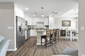 Bright and airy open-concept home with seamless flow between the living, dining, and kitchen areas—perfect for gathering and entertaining.
