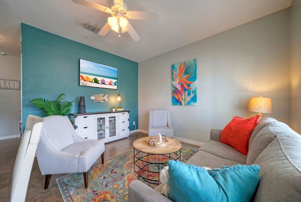 This cozy living room features a sleeper sofa and TV—perfect for relaxing movie nights or extra sleeping space for guests. (Unit 108)