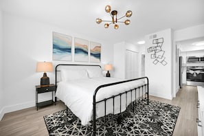 Elegant bedroom with Queen bed and wall painting in Boca Raton