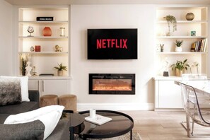Enjoy the best of entertainment in our living area with a smart TV, allowing you to stream your favorite shows and movies with ease. Relax on the comfortable sofa and immerse yourself in a world of entertainment