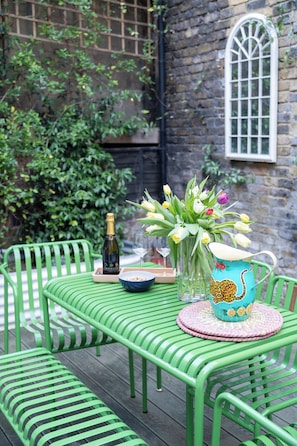 With a beautifully set table, lush greenery, and a serene atmosphere, this is the ideal spot to unwind and make lasting memories.