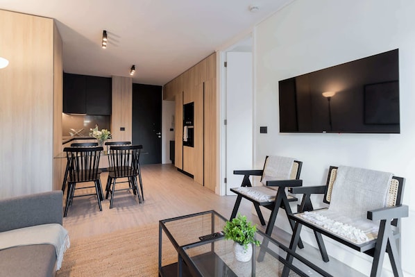 Experience modern comfort in this stylish living space, featuring sleek design and cozy furnishings for a relaxing getaway.