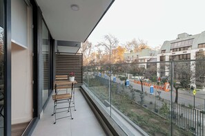 Relax on your private balcony with a charming street view, perfect for morning coffee or evening unwinding.