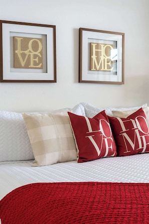 This spacious king-size bedroom with romantic decor comes with a private bathroom, TV, and a beautiful view. So, you can just relax after a long park day.