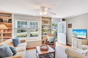 St. Simons Island Vacation Rental Living Room - This bright living room at 204 Ashantilly Avenue blends comfort and charm in the heart of St. Simons Island—part of Emmons Realty’s top-rated vacation rental collection.