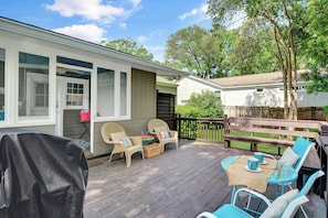 Spacious Back Deck With Grill - This St. Simons Island vacation rental features a large back deck with lounge seating, a grill, and space to enjoy dinner or drinks outdoors at 204 Ashantilly Avenue.