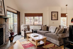 Living room with fireplace and river rock accents.